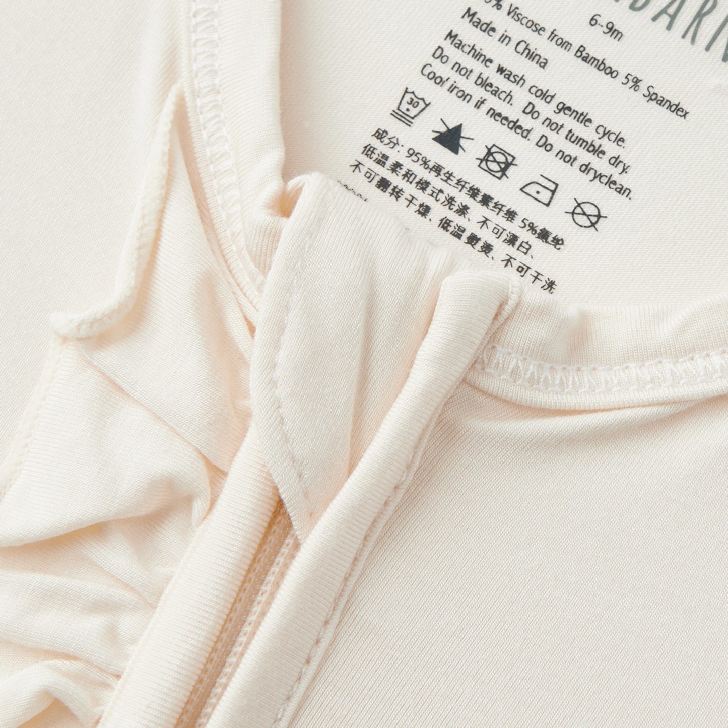 Salt Luxe Solid Ruffle Footed Romper