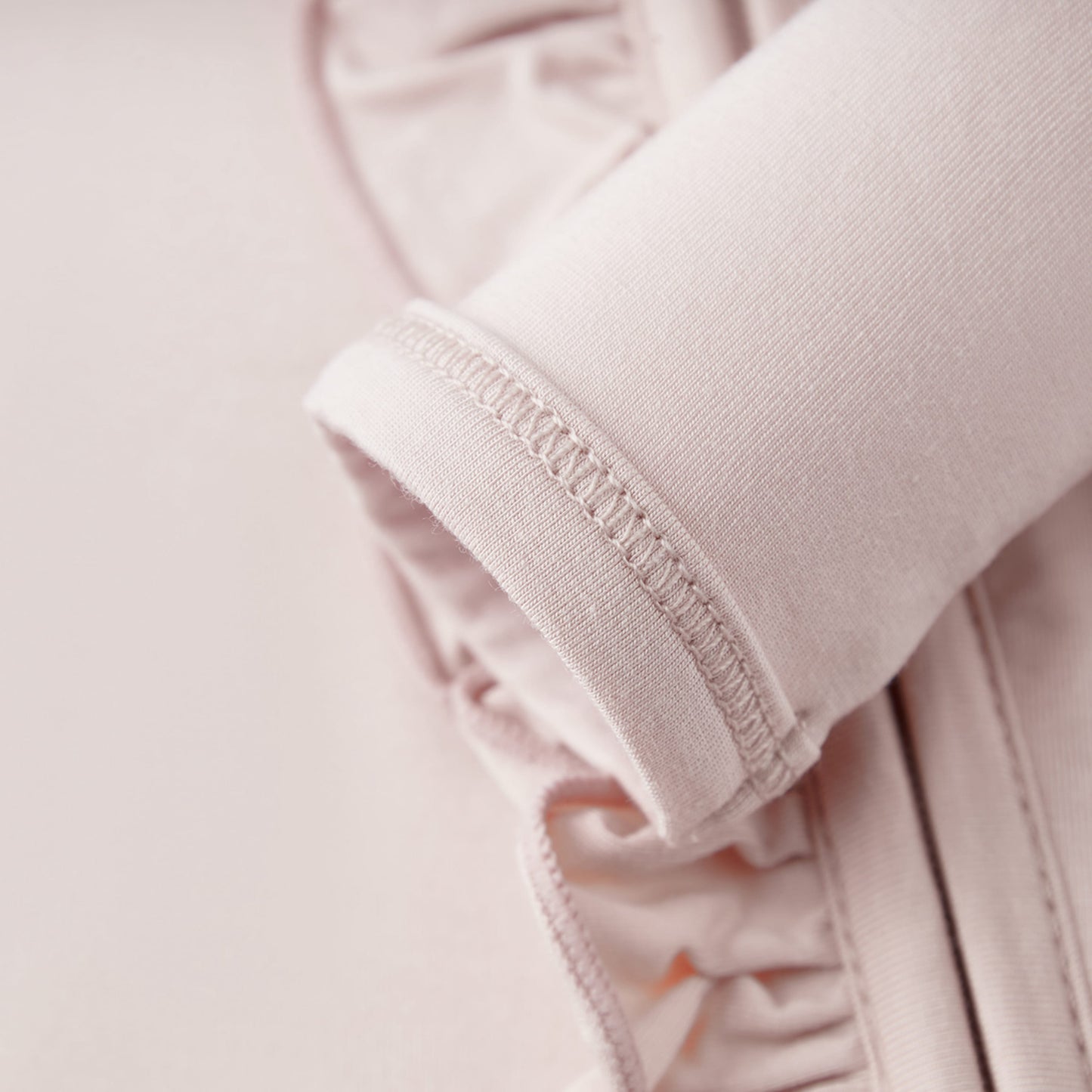 Sepia Rose Luxe Solid Ruffle Footed Romper