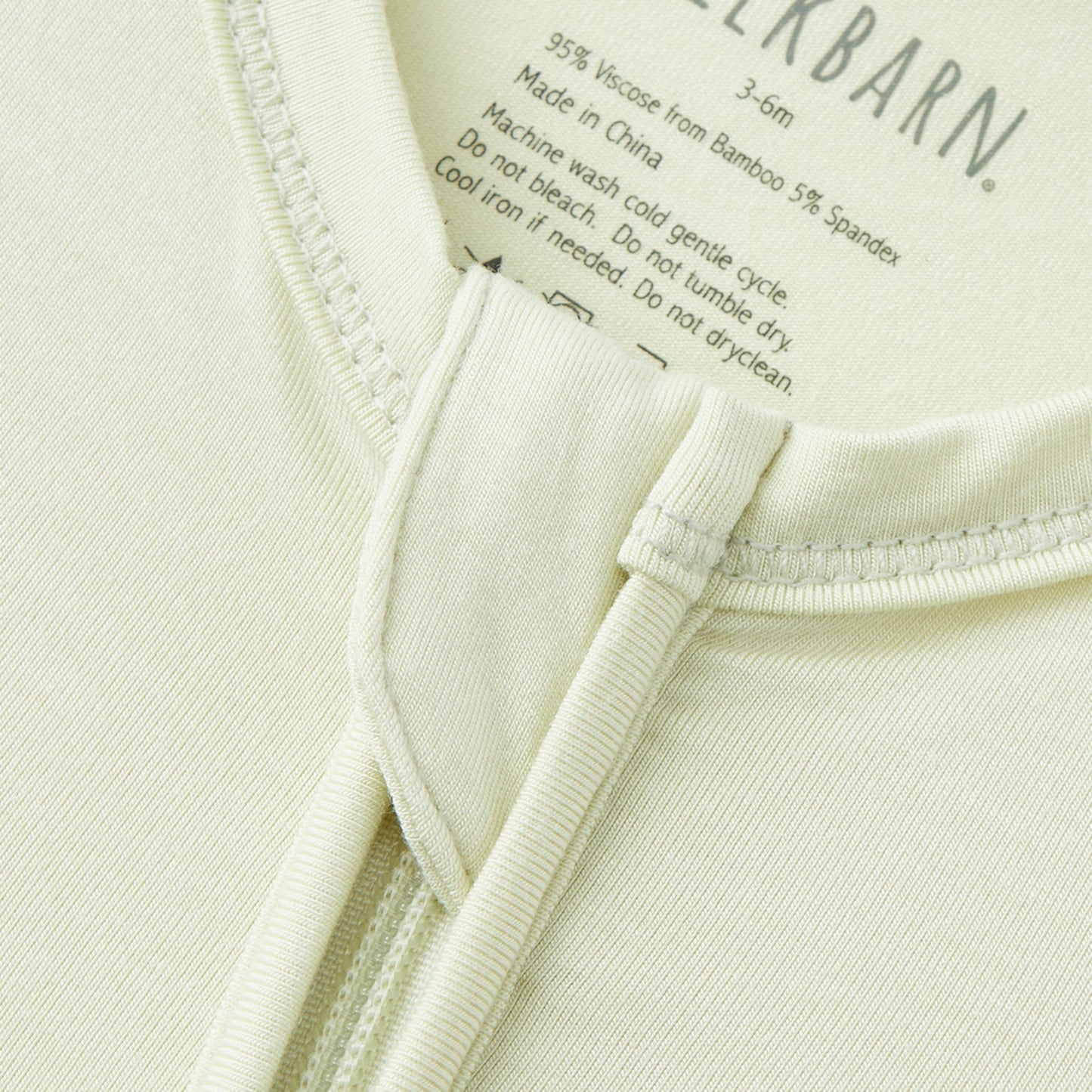 Aloe Luxe Solid Zipper Footed Romper